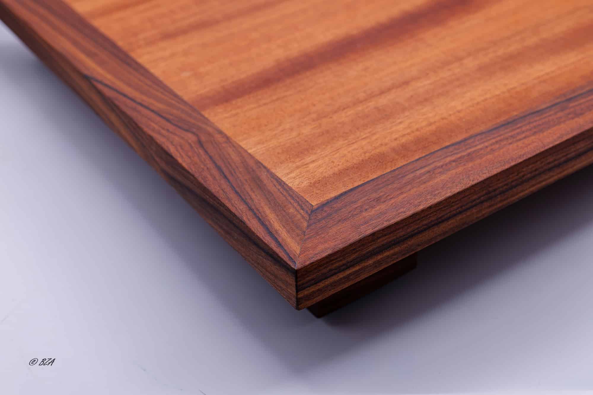 Close-up of Brazilian rosewood trim corner with layered wood grain